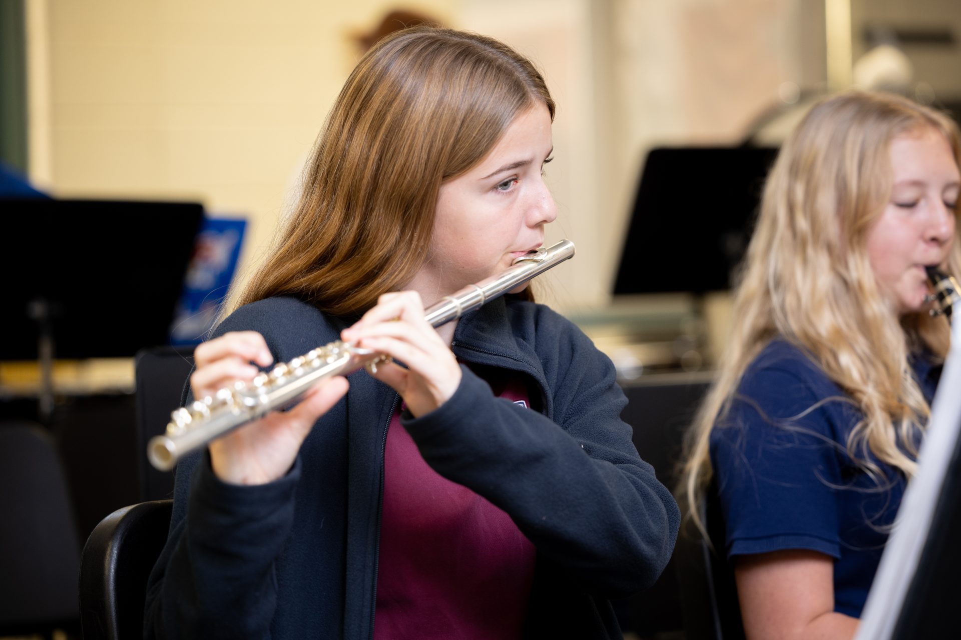Students play instruments in a vibrant music classroom, showcasing dedication and collaboration.