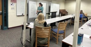 Livingston Classical Academy student teaches Latin grammar to instructors for a day in which students and teachers switch roles in the classroom!